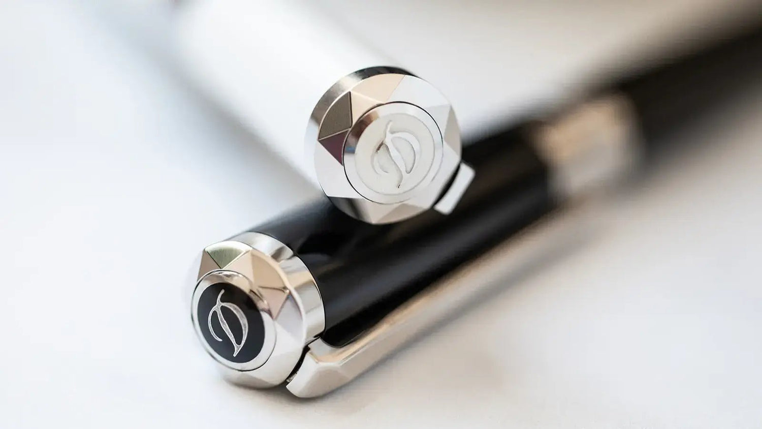 S.T. Dupont Liberte pens in white lacquer and black lacquer with palladium finish