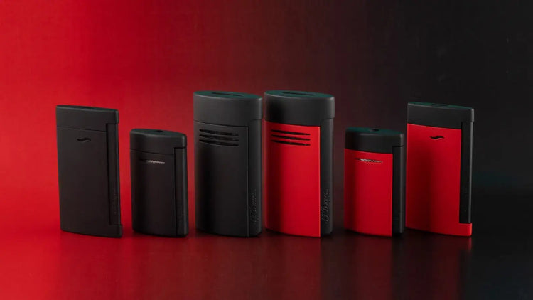 S.T. Dupont Matte Black and Matte Black and red jet lighters on a red and black background.