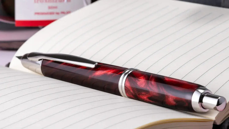 Pilot Vanishing Fountain pen with red marbled lacquer and rhodium finish.