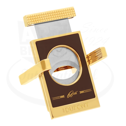 S.T. Dupont x Padron limited edition cigar cutter with stand, 003454, finished with brown lacquer and gold accents, seen with blade pulled up.