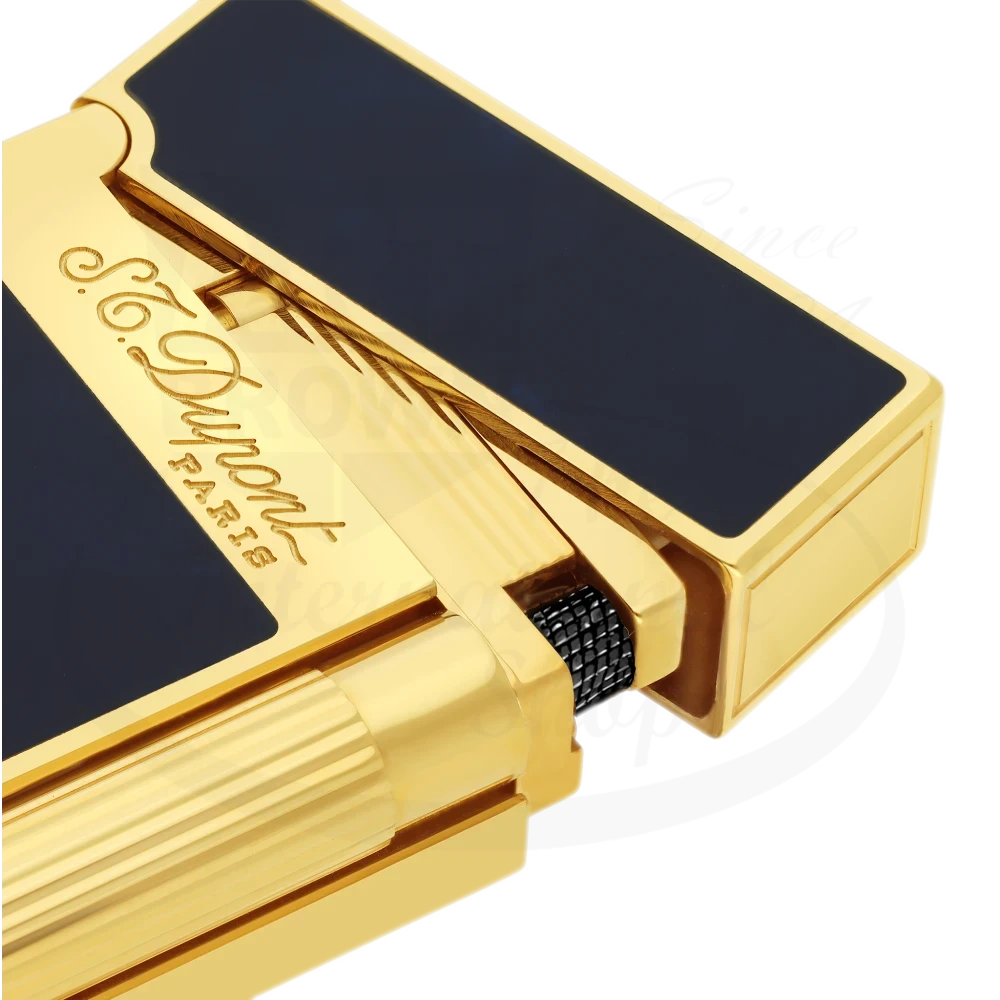 Close up of S.T. Dupont Atelier Line 2 lighter with dark blue lacquer and gold finish, showing detailed brand engraving.