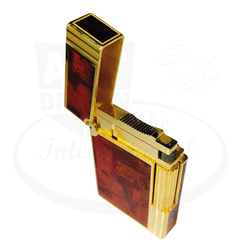 S.T .Dupont Gatsby lighter with orange lacquer and gold finish 018577, with lid open.