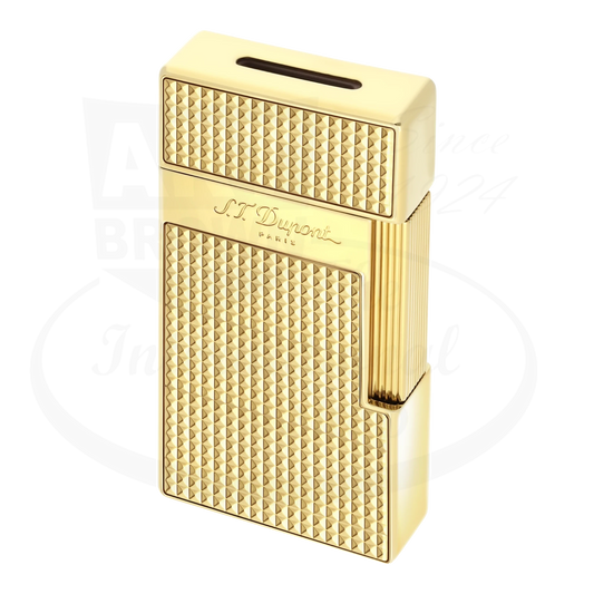 S.T. Dupont biggy lighter with diamond head guilloche and gold finish, seen from an angle.