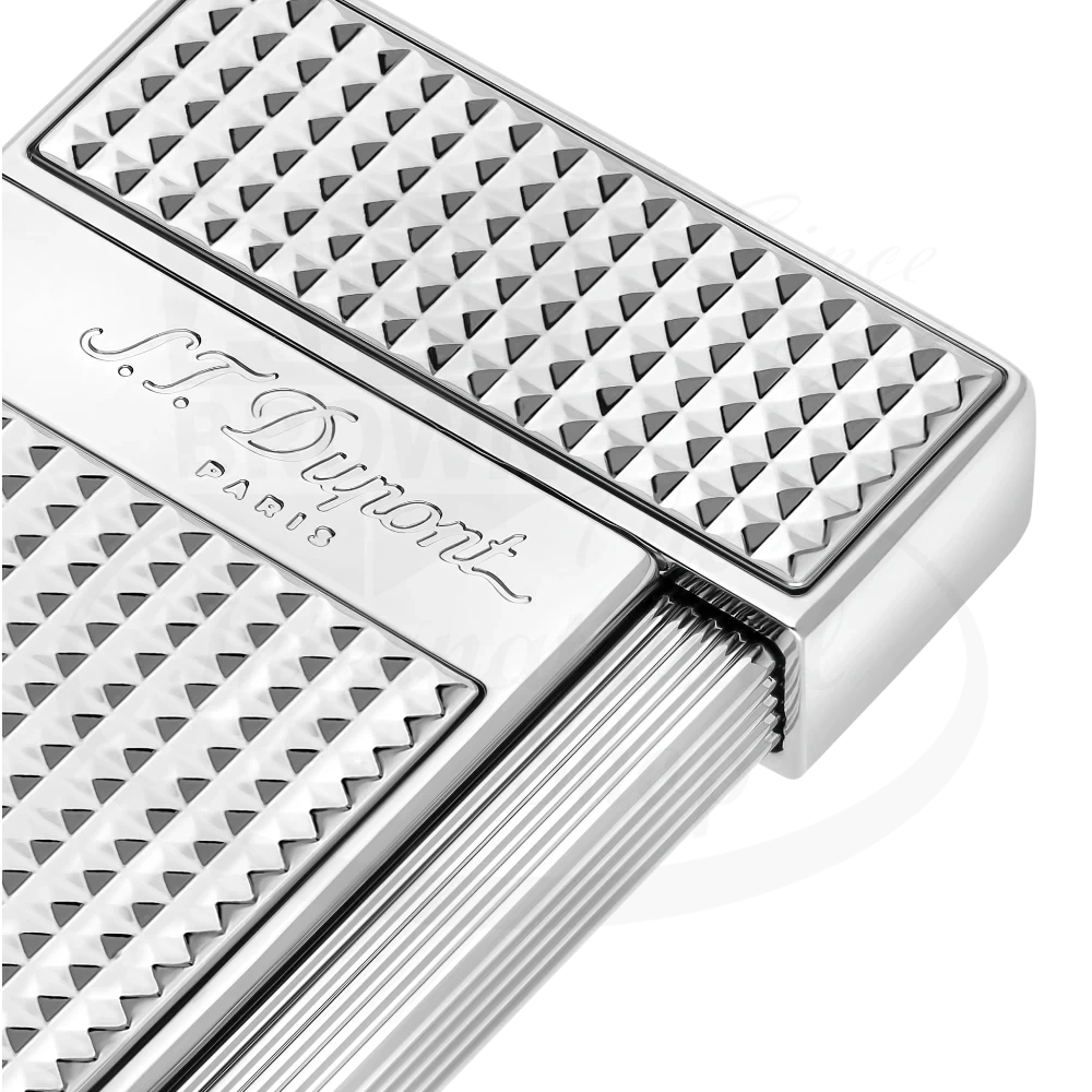 Corner of S.T. Dupont slimmy torch lighter diamond head pattern in chrome 