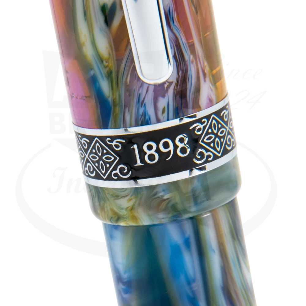 Close-up view of the Conklin 1898 Misto Green Rollerball Pen, showcasing its intricate multicolored marbled design and the engraved '1898' on the silver band.