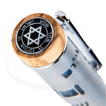 Close-up of the cap of the Conklin Jubilee 75th Anniversary of Israel pen, featuring a Star of David emblem on a wooden end cap with Hebrew inscriptions.