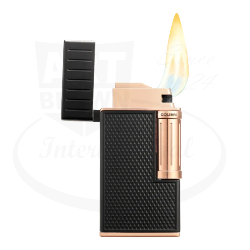 Colibri Julius Lighter in rose gold and black, shown with a lit flame and diamond-patterned grip.