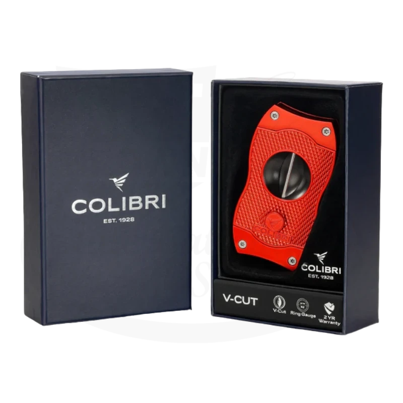 Colibri V-Cut Cigar Cutter in red, elegantly presented in a blue box with the Colibri logo and text 'V-Cut' on the front.