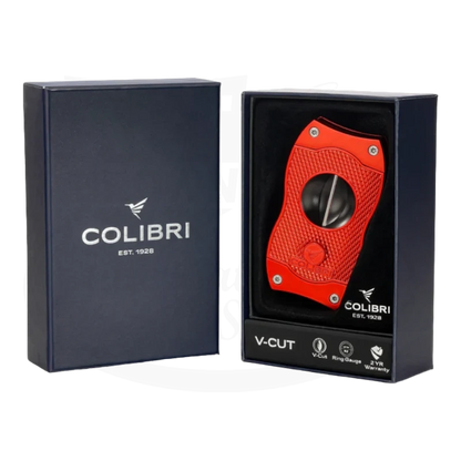 Colibri V-Cut Cigar Cutter in red, elegantly presented in a blue box with the Colibri logo and text 'V-Cut' on the front.