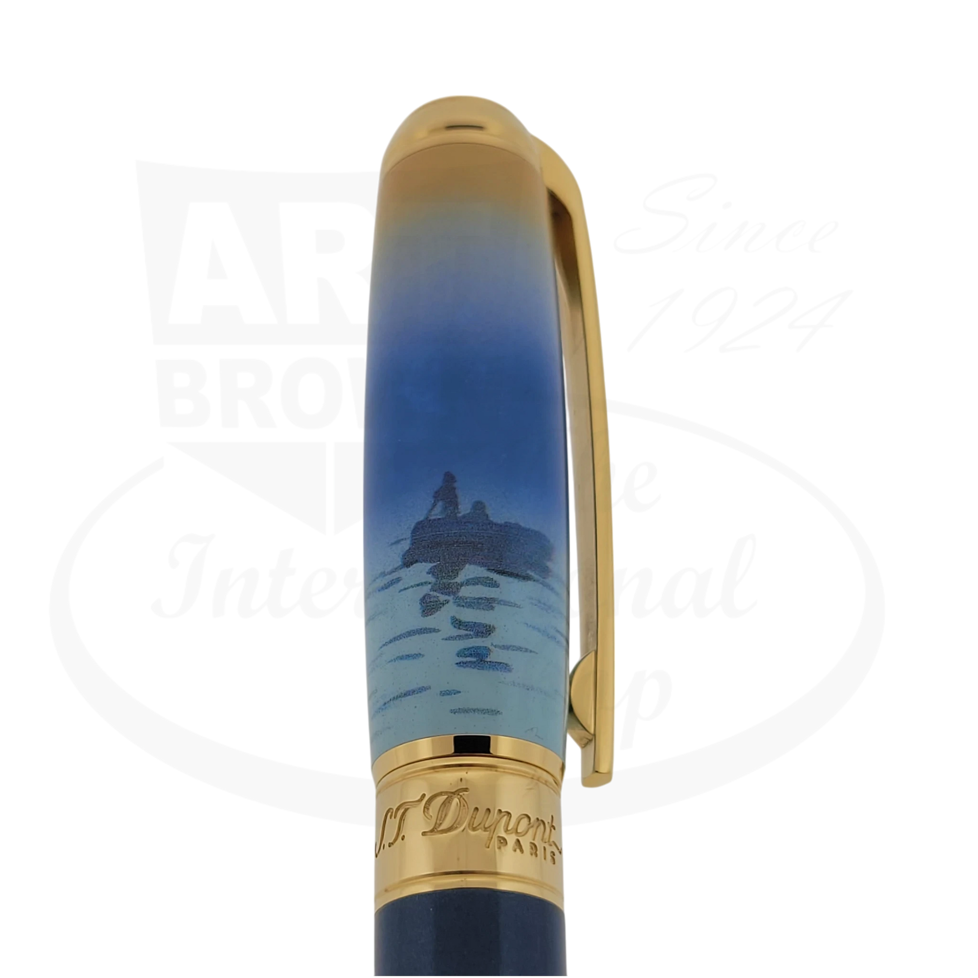 Detailed view of the Monet artwork on the S.T. Dupont Line D pen cap with gold accents.