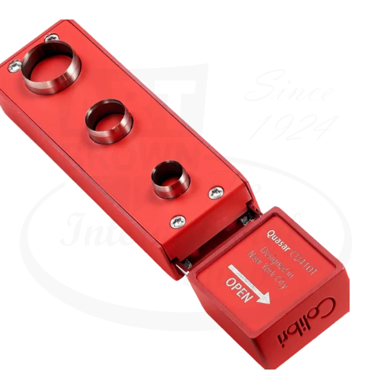 Colibri Quasar Cigar Punch in red, open to show the punch holes, designed in New York City.