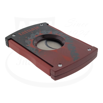 S.T. Dupont x Tatuaje cigar cutter in red and black seen closed from the side.