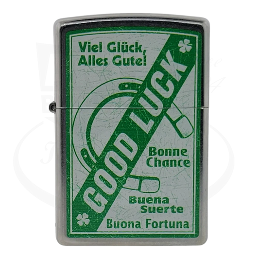 Front view of a Brushed Chrome lighter with a green 'Good Luck' design, showing the horseshoe and greetings in multiple languages.